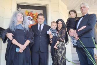 Gloria Goyette of Monroe and her family dressed up as the Addams Family for her granddaughter's fourth birthday party in lieu of trick or treating because Halloween is her favorite holiday. Pictured from left to right are: Gloria and Gerry Goyette and Joe, Joey, Amy, Vivian and Gary Thompson.