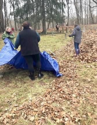 Members of We Are Woodbury (WAW) recently devoted their time and labor to clearing The Old Cemetery grounds and beginning the task of cleaning numerous gravestones of dirt and weathering to make them more readable.
