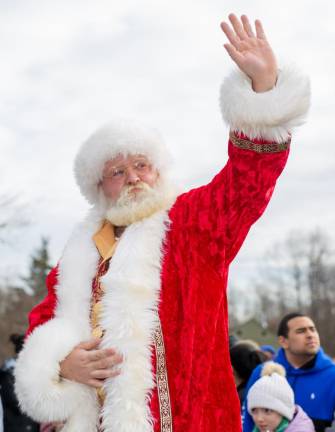 Santa waves hello to all the children and families who came out to welcome him to Monroe