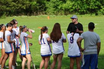 Coach Rob Alonso gives the team a pep talk.