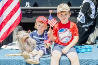Levi, 2, and James, 6, of Monroe waiting for the start of the Memorial Day Parade in Monroe.