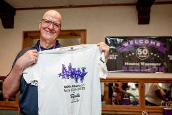 George Jung shows off his reunion t-shirt.