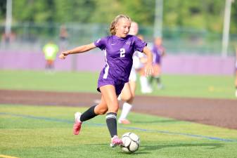 Crusader co-captain Amanda Sikorsky #2, attacks the Wildcat defense.