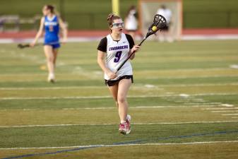 Joslyn Stone brings the ball up field on the attack.