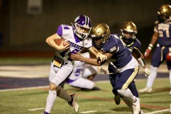 Crusader outside linebacker Liam Hayes (#14) finished the game as quarterback for the Crusaders after the starter was injured.