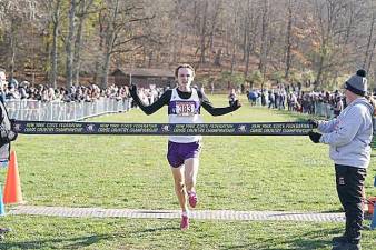 Caption for Finish.jpeg - Senior Collin Gilstrap takes first place at the NYS Federation Cross Country Championship.