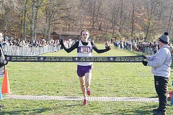 Caption for Finish.jpeg - Senior Collin Gilstrap takes first place at the NYS Federation Cross Country Championship.