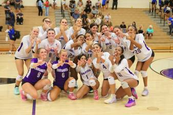 Crusader Volleyball team celebrates their 3-1 victory