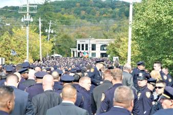 A sea of blue carried fallen New York City Police Officer, and Monroe native, Brian Mulkeen home Friday morning, as an NYPD detail of thousands gathered at the Church of the Sacred Heart to say farewell.