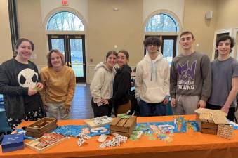 CTeen members Mikey Miller of Chetser, Ava Maier of Monroe, Haley Olstein of Monroe, Lola Sale of Highland Mills, Amir Mosker of Monroe, Ariel Koyfman of Chester and Evan Leeds of Chester decorate and assemble Passover Sensory Packages for Chabad’s Friendship Circle, which benefits children and teens with special needs at the new Chabad Center for Jewish life in Monroe.