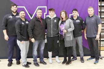 Senior Nicholas Hansen, his parents and coaches celebrate Senior Day. Photos by William Dimmit.