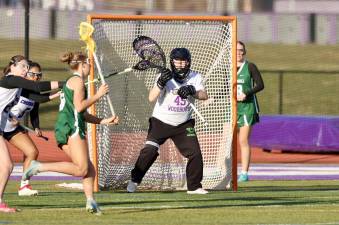 Monroe-Woodbury goalie Lilly Crowley (#45) had a strong game in goal for the Crusaders in their 13-7 season-opening victory March 25 at home in Central Valley against Cornwall. Photos by William Dimmit.