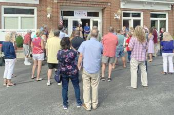 Chele Farley, Republican and Conservative candidate in New York’s 18th Congressional district, speaks with well-wishers at the opening of her campaign office at 25 Main St. in Goshen. (Provided photos).