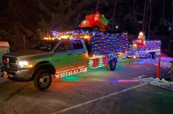 A Christmas light parade was held in Eagle Valley section of Tuxedo on Sunday, Dec. 12. The parade featured more than 30 vehicles and floats adorned with lights and holiday characters. Photos provided by Shari Brooks.