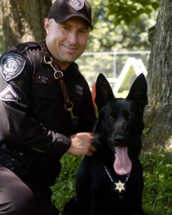 1st Sergeant Jeremy Yela and K-9 Justus.