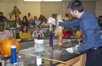 Chemistry professor Dustin McCall conducts a dry ice demonstration.