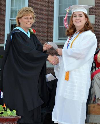 Nancy Teed, the Tuxedo School District's interim superintendent, presents Valedictorian Madeline Doyle with her diploma.