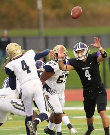 Colin Douthit (#4) gets his hands up as he rushes the Goldback quarterback late in the game.