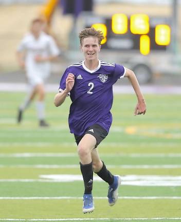 Eric Shippee (#2) chases down a loose ball.