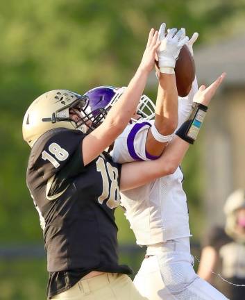 Crusader Conor Fitzgibbon stopped the Hawks’ drive when he came down with this interception in the end zone.