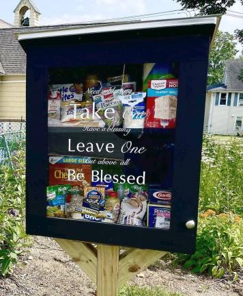 The box is a miniature food pantry – receiving items from those who want to donate, and offering it to those who need them.