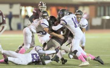 Crusader defense swarm over a Kingston running back.