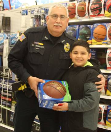 Woodbury Police Officer Scott Danielson with Elijah Sosa