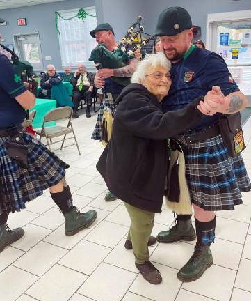 “This is our wonderful Senior Lily,” Woodbury Supervisor Kate Luciani said. “She was dancing with her walker with the Shields band when the one member put down his drum to dance with her. Was a moment that everyone in the room felt in their hearts.”