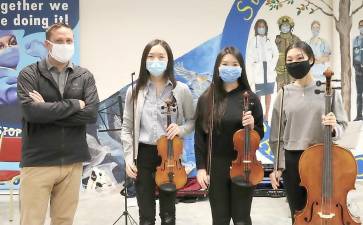 Pictured from left to right are Orange County Executive Steven M. Neuhaus and Monroe-Woodbury High School musicians Stephanie Peng, Jennifer Song and Emily Wang. Photo provided by Orange County.