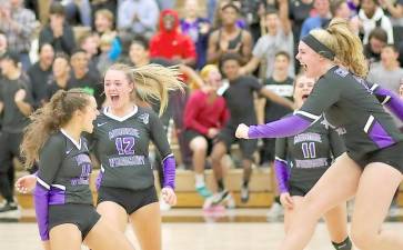 The Crusaders show the intensity of the rivalry as they react to wining the first set against Pine Bush.