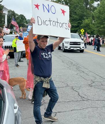 A protester from Pine Bush shows his No Kings Day sign in Goshen.