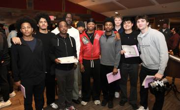 Members of the Boys Varsity team celebrate another season.