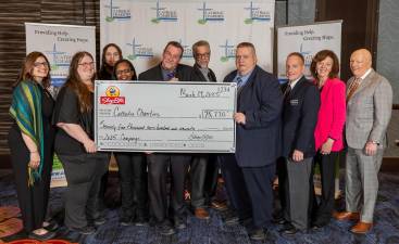 At Catholic Charities of Orange, Sullivan, and Ulster’s annual Celebration of Charity dinner, ShopRite Supermarket store representatives presented Catholic Charities’ CEO Shannon Kelly (far left) and Board Chair Thomas Strahle (far right) with the ceremonial check for $75,770 from the 2025 in-store Feeding Our Neighbors campaign. Photo by Everett Collie, EC Media Group.