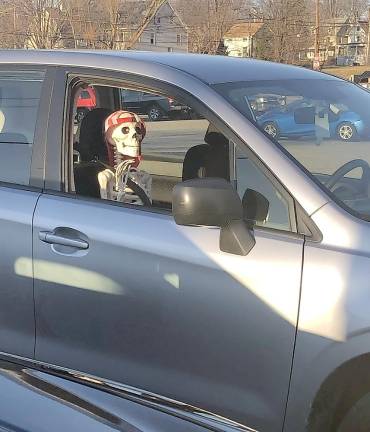 FInding humor where you can: Someone put a skeleton in his passenger seat in parking lot on Millpond Parkway next to the bus stop in Monroe.