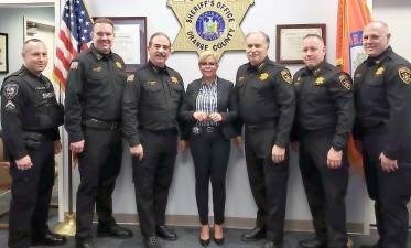 From left: DSPBA President Jeremy Yela, Chief Dennis Barry, Undersheriff Ken Jones, Deputy Carolina Manon, Sheriff Carl E. DuBois, Assistant Undersheriff Tony Weed, and Captain Paul Arteta