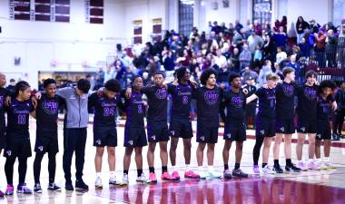 The M-W Crusaders line up for the National Anthem before the March 5 game.