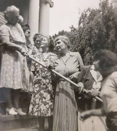 Helen Keller, center in the striped dress, on the steps of Rest Haven in 1950. This historic home served the blind for 45 years.