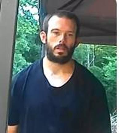Murder suspect Thomas Ryan, 32, of Greenville, was arrested shortly after midnight Sunday.
