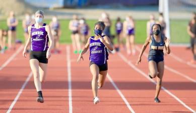 Crusader Kaylen Tenemille, took first in the 100 and 200 meter dash and helped the 4x100 relay team to victory. Photos by William Dimmit.