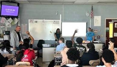 Monroe-Woodbury High School students Mia Flores and Nolnaree Chada give a presentation on the impacts of traditional gemstone mining.