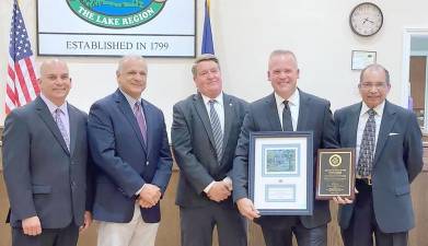 Pictured from left to right are: Monroe Town Councilman Sal Scancarello, Town Supervisor Tony Cardone, Town Councilman Mike McGinn, Sgt. Doug Krauss and Town Councilman Rick Colon. Not pictured: Town Councilwoman Mary Bingham. Photo provided by the Town of Monroe.