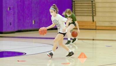 Ciarra Lorusso practices her crossover dribble. Photos by William Dimmit.