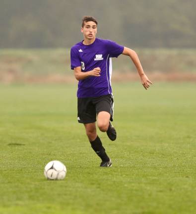 Joseph Olivette (#8) races the length of the field to score the game's final goal.