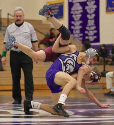 Photos by William Dimmit Dylan Earl (113 lbs.) takes down his Tiger opponent before pinning him at the 5:31 mark.