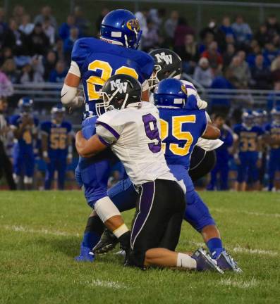 Photos by William Dimmit Zack Vanier (#9) records one of his two sacks in the game.