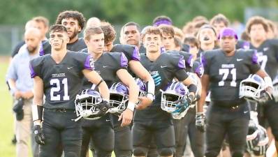 Crusaders line up for the National Anthem to start their new season. Photos by William Dimmit.