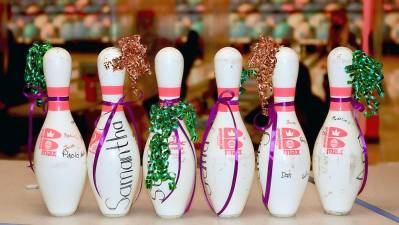 The Crusaders celebrate Senior Day at Colonial Lanes in Chester by presenting each senior with a decorated bowling pin that had been autographed by their teammates.