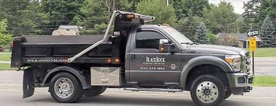 Black Rock Excavating in Cornwall delivers a , 1.5 ton boulder, gifted to the Pine Tree PTA by Callahan and Nannini Quarry in Salisbury Mills, and plopped it on the elementary school’s front yard.