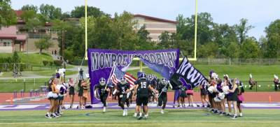 The Monroe-Woodbury Crusaders bust through the banner to start the 2023 football season. Photos by William Dimmit.
