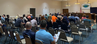 Crowd gathered at the June 8 Monroe Town Board meeting where the canceled food truck festival and other matters were discussed.